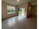 Bright dining room with tile floors and access to patio at 2008 Red Rock Rd, New Smyrna Beach, FL 32168