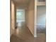 Long hallway with tile flooring and access to other rooms at 2008 Red Rock Rd, New Smyrna Beach, FL 32168