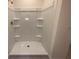 White shower with built-in shelving at 2008 Red Rock Rd, New Smyrna Beach, FL 32168