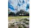 Large backyard with grassy area and mature trees at 2677 Tansboro Dr, Deltona, FL 32725