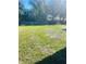 Large backyard with grassy area and privacy fence at 2677 Tansboro Dr, Deltona, FL 32725