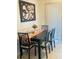 Dining area with four chairs and a dark wood table at 2677 Tansboro Dr, Deltona, FL 32725