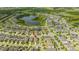 Aerial view showcasing a house in a community by a lake at 16467 Olive Hill Dr, Winter Garden, FL 34787