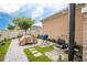 Landscaped backyard with patio and outdoor shower at 16467 Olive Hill Dr, Winter Garden, FL 34787