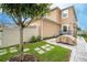 Private backyard with stone pathway and covered patio at 16467 Olive Hill Dr, Winter Garden, FL 34787
