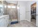 Bathroom features double vanity, walk-in shower, and access to closet at 16467 Olive Hill Dr, Winter Garden, FL 34787