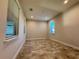 Bright bedroom with neutral walls and tiled floors at 16467 Olive Hill Dr, Winter Garden, FL 34787