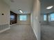 Spacious bonus room with wood accent wall and neutral carpeting at 16467 Olive Hill Dr, Winter Garden, FL 34787