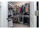 Large walk-in closet with ample hanging space and shelving at 16467 Olive Hill Dr, Winter Garden, FL 34787