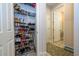 Well-organized closet with shoe rack and additional storage at 16467 Olive Hill Dr, Winter Garden, FL 34787