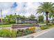 Hawksmoor community entrance with landscaping and signage at 16467 Olive Hill Dr, Winter Garden, FL 34787