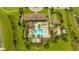 Aerial view of community pool with lounge chairs and landscaping at 16467 Olive Hill Dr, Winter Garden, FL 34787
