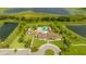 Aerial view of community pool with clubhouse and surrounding landscape at 16467 Olive Hill Dr, Winter Garden, FL 34787