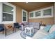Relaxing covered patio furnished with comfortable seating at 16467 Olive Hill Dr, Winter Garden, FL 34787