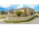 Tan two-story house with a beige vinyl fence at 16467 Olive Hill Dr, Winter Garden, FL 34787