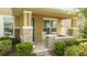 Front porch with rocking chairs and brick columns at 16467 Olive Hill Dr, Winter Garden, FL 34787