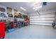Organized garage with workbench, tools, and storage at 16467 Olive Hill Dr, Winter Garden, FL 34787
