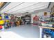 Organized garage with ample storage and work bench at 16467 Olive Hill Dr, Winter Garden, FL 34787