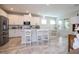 Modern kitchen with stainless steel appliances and white cabinetry at 16467 Olive Hill Dr, Winter Garden, FL 34787