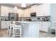 Bright kitchen featuring white cabinets and a large island at 16467 Olive Hill Dr, Winter Garden, FL 34787