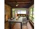 Beautiful dining room features a brick wall, tile floors and an outdoor view at 20319 Macon Pkwy, Orlando, FL 32833