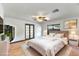 Comfortable main bedroom features ceiling fan, closet, and ensuite bathroom at 20319 Macon Pkwy, Orlando, FL 32833