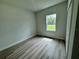 Bright bedroom with wood-look floors and ample closet space at 3325 Sw 165Th Loop, Ocala, FL 34473