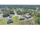 A beautiful aerial perspective of homes surrounded by lush greenery and winding neighborhood streets at 15062 Sw 63Rd Court Rd, Ocala, FL 34473