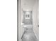 Bright bathroom featuring a tub with marble tile surround and marble tile flooring at 15062 Sw 63Rd Court Rd, Ocala, FL 34473