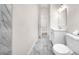 Bathroom featuring marble flooring, a white vanity, and a doorway to another room at 15062 Sw 63Rd Court Rd, Ocala, FL 34473