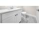 Bathroom featuring a modern white vanity and toilet with a gray-toned marble-look tile floor at 15062 Sw 63Rd Court Rd, Ocala, FL 34473