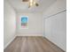 Bedroom featuring wood-look floors and a closet for ample storage at 15062 Sw 63Rd Court Rd, Ocala, FL 34473