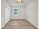 Bedroom featuring wood-look floors and a convenient closet at 15062 Sw 63Rd Court Rd, Ocala, FL 34473