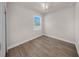 Bedroom featuring wood-look flooring, a ceiling fan, and a window providing natural light at 15062 Sw 63Rd Court Rd, Ocala, FL 34473