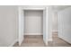 Open closet featuring wood-look flooring and double doors at 15062 Sw 63Rd Court Rd, Ocala, FL 34473