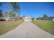 Charming single-story home features a well-manicured lawn and an attached two-car garage at 15062 Sw 63Rd Court Rd, Ocala, FL 34473
