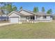 Beautiful single-Gathering home featuring a long driveway and an attached two-car garage at 15062 Sw 63Rd Court Rd, Ocala, FL 34473