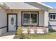 The inviting front entrance showcases manicured landscaping and decorative lighting at 15062 Sw 63Rd Court Rd, Ocala, FL 34473