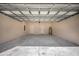 A large garage with access doors and concrete flooring provides ample storage space at 15062 Sw 63Rd Court Rd, Ocala, FL 34473