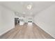 Bright and airy living room showcasing wood-look floors and seamless connection to the kitchen at 15062 Sw 63Rd Court Rd, Ocala, FL 34473