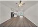 Open-concept living room with wood-look floors and views of the kitchen at 15062 Sw 63Rd Court Rd, Ocala, FL 34473