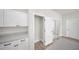 Pantry with white cabinets, light countertop, and sliding glass door at 15062 Sw 63Rd Court Rd, Ocala, FL 34473
