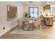 Dining room with modern furniture, stylish decor, and sliding glass door to backyard at 4814 Lake Shore Dr, St Cloud, FL 34772