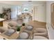 Open-concept living room with hardwood floors, contemporary furniture, and plenty of natural light at 4814 Lake Shore Dr, St Cloud, FL 34772