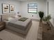 Cozy main bedroom with a large window, neutral decor, and modern furnishings at 4814 Lake Shore Dr, St Cloud, FL 34772