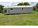 Single story house with light gray siding and small front porch at 575 2Nd St, Oviedo, FL 32765