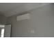 Bright interior room with mini-split AC unit and recessed lighting at 0 2Nd St, Oviedo, FL 32765