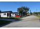 Residential street with small houses and parked cars at 575 2Nd St, Oviedo, FL 32765