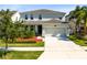 Two-story house with two-car garage and well-manicured lawn at 2275 Cathedral Rock Dr, Kissimmee, FL 34746