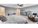 Main bedroom with a king-size bed, dresser, and ceiling fan at 2275 Cathedral Rock Dr, Kissimmee, FL 34746